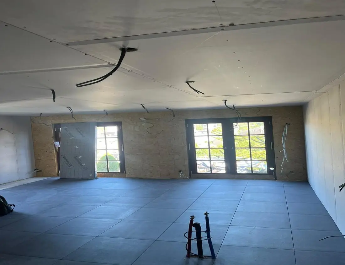 New room under construction with electrical cables ready in the ceiling and walls